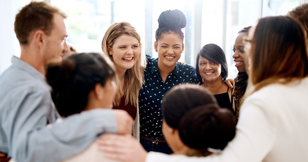 team members standing in a circle